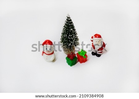 christmas composition with santa claus, snowman, fir tree and gifts on a white background. christmas and new year celebration concept