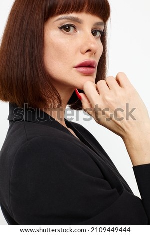 photo pretty woman in a full-length leather suit luxury isolated background