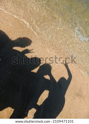 picture silhouette on the beach sand
