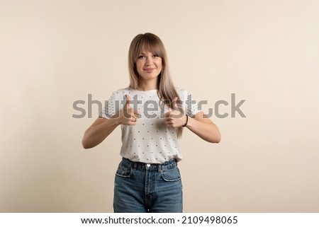 Young Attractive Woman Show Okay Sign and Thumb Up. Positive Girl Showing OK Gesture. People Sincere Emotions. Lifestyle Concept.