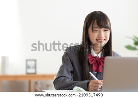 Junior high school students studying at home Royalty-Free Stock Photo #2109517490