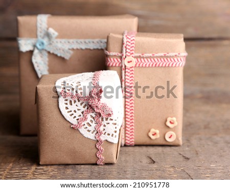 Cute gift boxes on wooden background