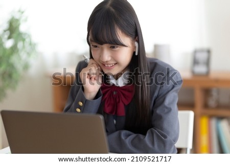 Junior high school students studying at home Royalty-Free Stock Photo #2109521717
