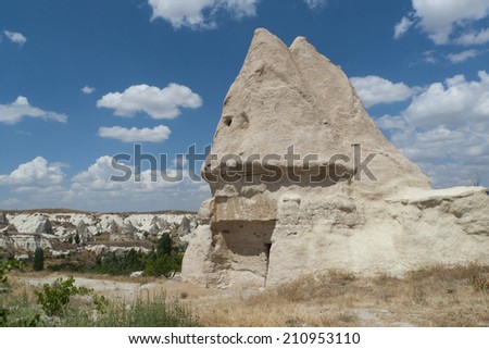 Cave house in Cappadocia, Turkey with blue sky and view to background