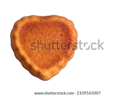 Cupcake in the form of a heart isolated on a white background.