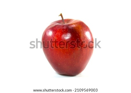 Delicious red apple placed against a white background.