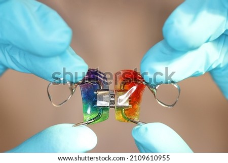 orthodontic apparatus for expanding the upper jaw. Wearing a plate is a very popular solution for correcting congenital defects of the jaw. haas apparatus. pediatric dentistry, orthodontics concept Royalty-Free Stock Photo #2109610955