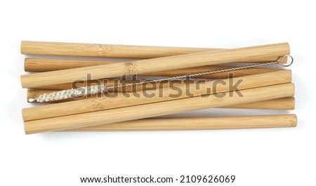 Bamboo straws isoalted on white background. Drinking straws from bamboo wood for reusing and reducing the use of plastic straw. Royalty-Free Stock Photo #2109626069