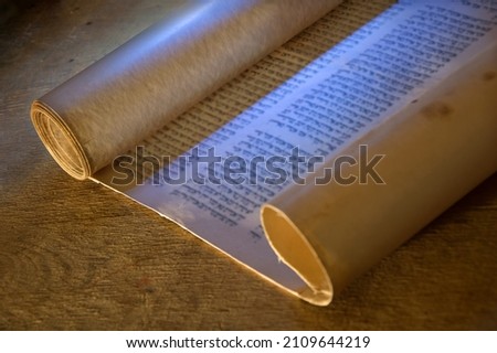 Grunge age dirty brown pray belief Moses law believe dark night wooden desk table space. Closeup judaic sacred church library prayer culture god Jesus Christ literary past art wood still life concept Royalty-Free Stock Photo #2109644219
