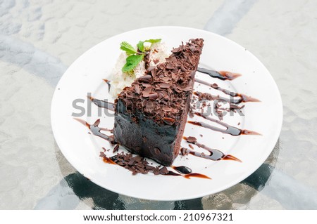 Chocolate cake with chocolate on the plate.