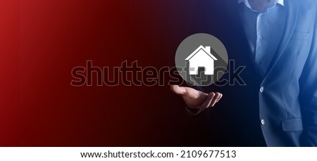 Real estate concept, businessman holding a house icon.House on Hand.Property insurance and security concept. Protecting gesture of man and symbol of house.flat icons with long shadows.
