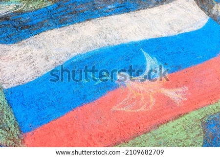 the Russian flag is drawn by a child on the pavement, a temporary drawing. Russian flag colors