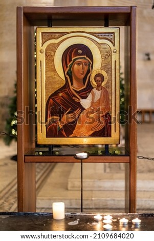 Picture of Virgin Mary holding Jesus with gold at Tabgha or The Church of the Multiplication of the Loaves and Fishes also called Church of the Loaves and Fishes on the Sea of Galilee in Israel

