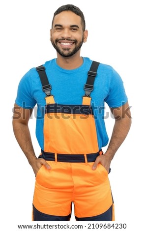 Laughing hispanic construction worker with orange protective gear isolated on white background for cut out Royalty-Free Stock Photo #2109684230