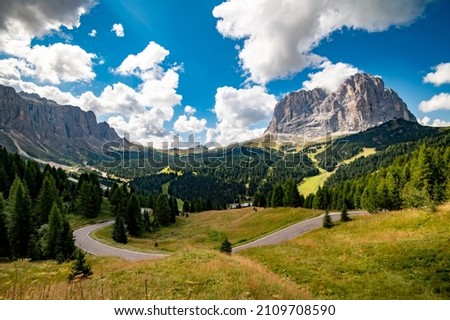 View of Sassolungo Langkofel mountain from Selva. Gardena Pass, Trentino Alto Adige, Italy. Sassolungo mountain in background. Passo Gardena, alpine pass between Val Badia and Val Gardena, South Tyrol Royalty-Free Stock Photo #2109708590