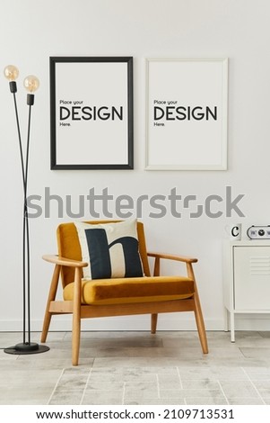 Retro and minimalist compositon of living room interior with design armchair, mock up poster map, lamp, decoration, white wall and personal accessories. Template. Modern home decor.