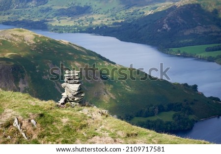 Views of Ullswater with the summits of Hallin Fell on the left, Green Hill on the top right from the summit of Bonscale Pike in the English Lake District, England, UK. Royalty-Free Stock Photo #2109717581