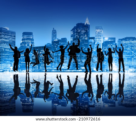 Group Of Happy Business People Silhouettes Jumping For Celebration On Cityscape Background