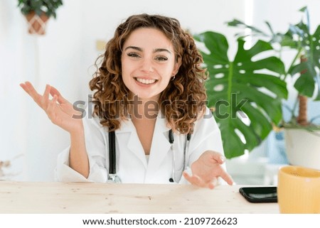female doctor talking to patient, laptop hospital video call