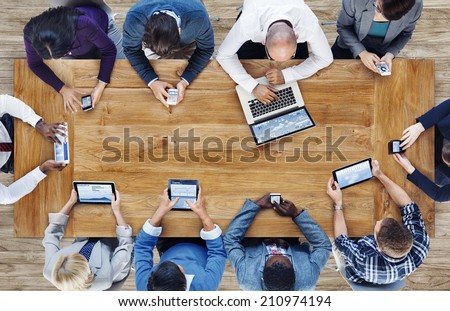 Group of Business People Using Digital Devices Royalty-Free Stock Photo #210974194