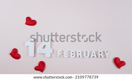 three-dimensional inscription in white on February 14 on a light background 2022