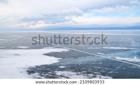 Beautiful scenery of snow mountain with frozen lake during winter season at Russia, Europe. 