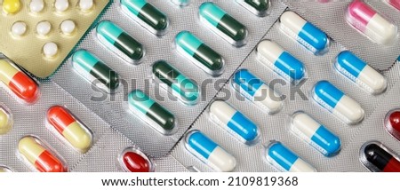 close up pharmaceuticals antibiotics pills medicine in blister packs. colorful antibacterials pills Pharmacy background. capsule pill medicine Antimicrobial drug resistance. Pharmaceutical industry Royalty-Free Stock Photo #2109819368