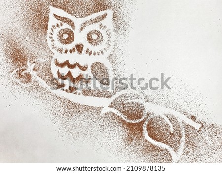 Light background. Owl on a branch of instant coffee with copy space.
