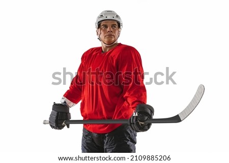Maintaining game spirit. Winning match. Professional male hockey player isolated over white background. Championship, competition, team game. Concept of action, team sport game, energy, ad