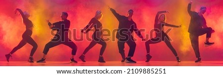 Collage. Street dancer. Two hip-hop dancers in motion isolated over gradient pink yellow background in neon light. Youth culture. Concept of dance, youth, hobby, dynamics, movement, action, ad