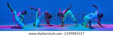 Collage. Young stylish girl, contemp dancer in motion, dancing isolated over blue background in neon light. Flexibility. Concept of youth culture, movement, active lifestyle, action, street dance, ad