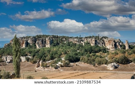 Historical ancient Frig (Phrygia, Gordion) Valley. Monuments, structures, carved into rocks. Frig Valley is popular tourist attraction in the Yazilikaya, Afyon - TURKEY. Royalty-Free Stock Photo #2109887534