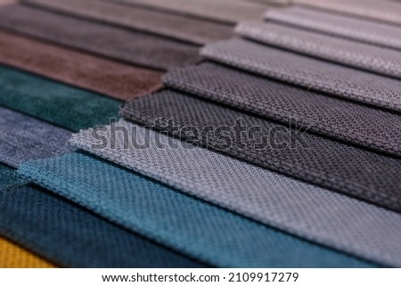Samples of furniture fabrics.Multicolor fabric texture background.