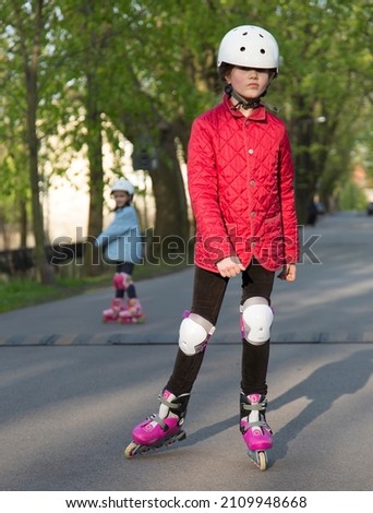 children learning to skate on the street