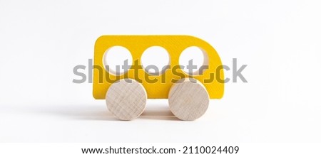 Wooden toy car in cartoon style on white background. Colorful and Transportation background, eco kid toys Montessori . 