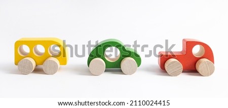 Wooden toy car in cartoon style on white background. Colorful and Transportation background, eco kid toys Montessori . 
