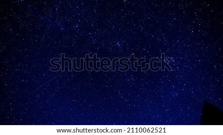 Glittering stars shining in the night sky, the appearance of stars falling