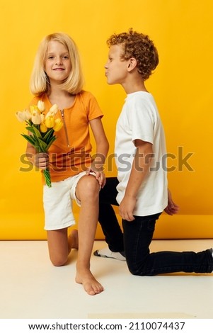 boy and girl with a bouquet of flowers friendship gift