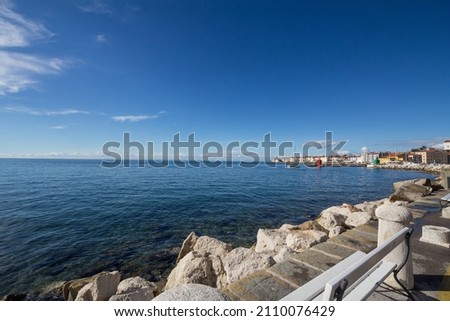 Panorama of the Adriatic sea, with blue water and sky, on a wharf and quay in Piran, slovenia, during a sunny summer afternoon. Piran, or Pirano, is a slovenian city on the adriatic sea in istria.

 Royalty-Free Stock Photo #2110076429