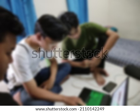 de focused and blurry photo of students studying together