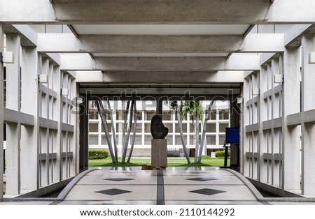 The geometry of concrete building with repeating structure and Symmetry exterior. Selective focus.