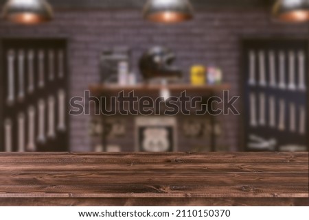 Blur motorcycle workshop wrench tools on wood space for products montage advertising background. Royalty-Free Stock Photo #2110150370