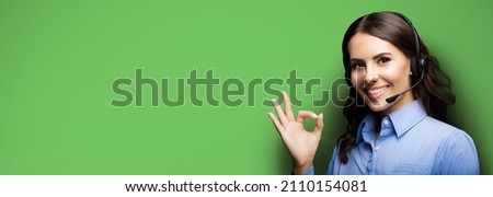 Customer support phone operator in headset showing ok okay or zero hand sign gesture isolated on green color background. Consulting and assistance service call center. Caller answer adviser callcenter