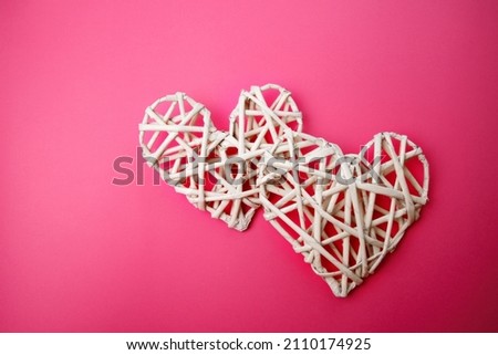 Two white hearts on a pink background. Concept Valentine's Day, Wedding Decoration. Flat lay, top view.