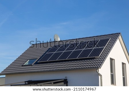Single family house with solar system or photovoltaic system Royalty-Free Stock Photo #2110174967