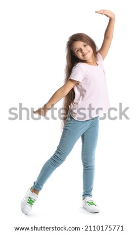 Cute little girl in t-shirt dancing on white background