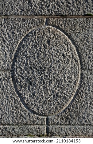 Gray stone wall texture, decorative ellipse engraving Royalty-Free Stock Photo #2110184153