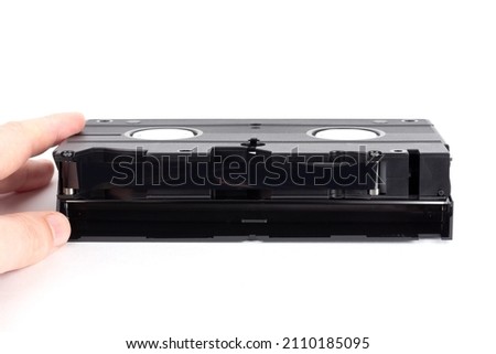 male fingers opened a videotape on a white background close-up