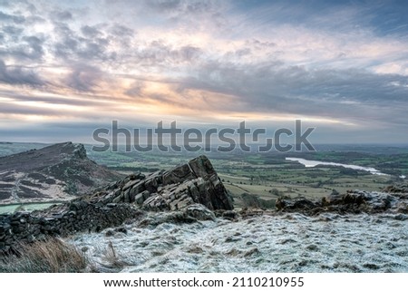Panoramic view from The Roaches, Staffordshire. Winter sunrise in the Peak District National Park, UK. Royalty-Free Stock Photo #2110210955