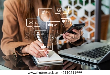 Social media and Marketing virtual icons screen concept.close up of businesswoman typing keyboard with laptop computer  Royalty-Free Stock Photo #2110211999